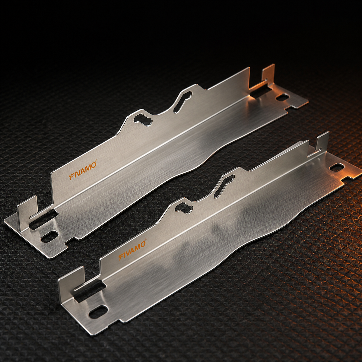 Close view of two silver FIVAMO toe alignment plates